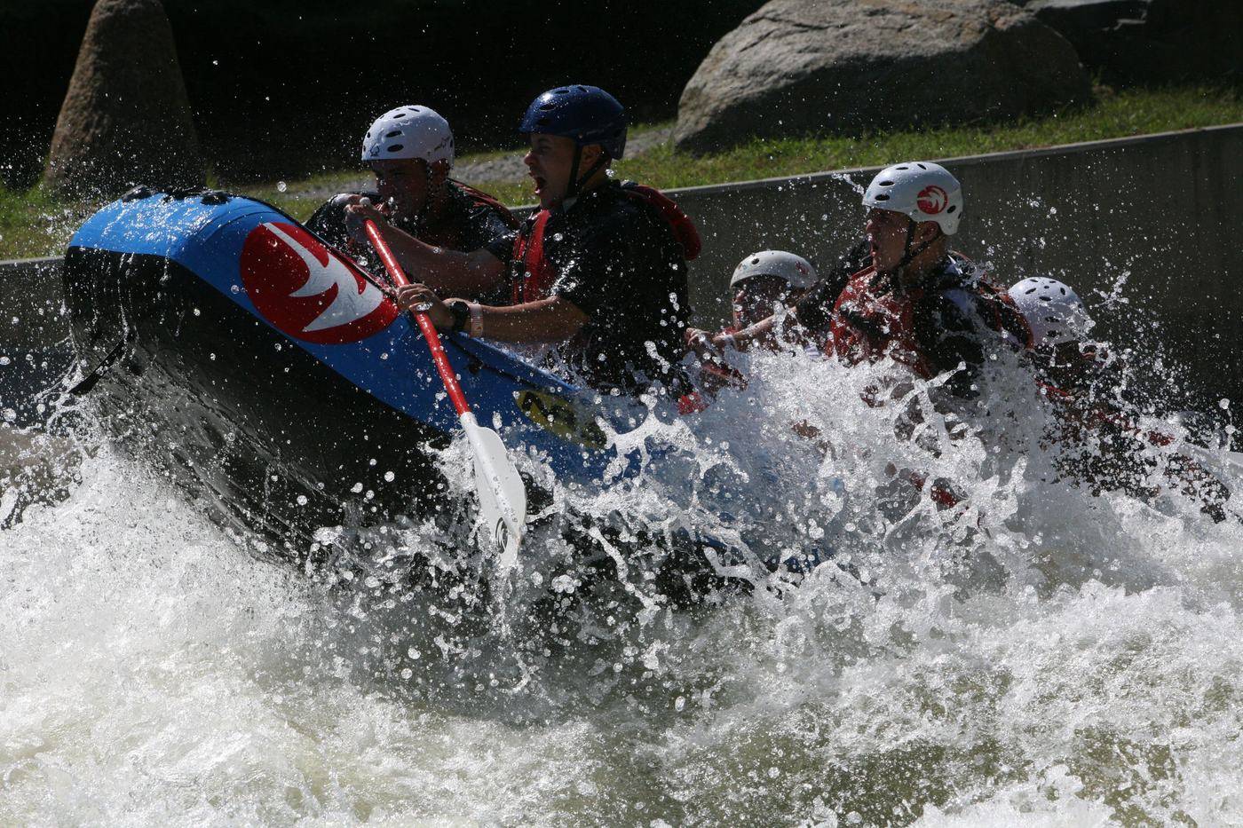 Rafters turning through rapids at the U.S. National Whitewater Center